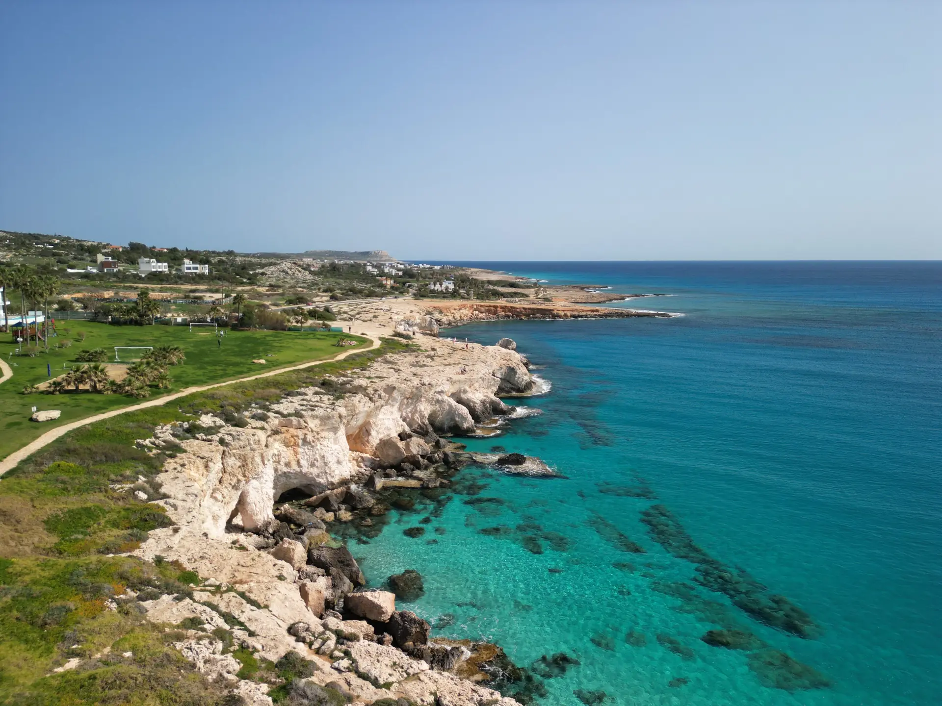 Turquoise water and white limestone cliffs along the Cyprus coast
