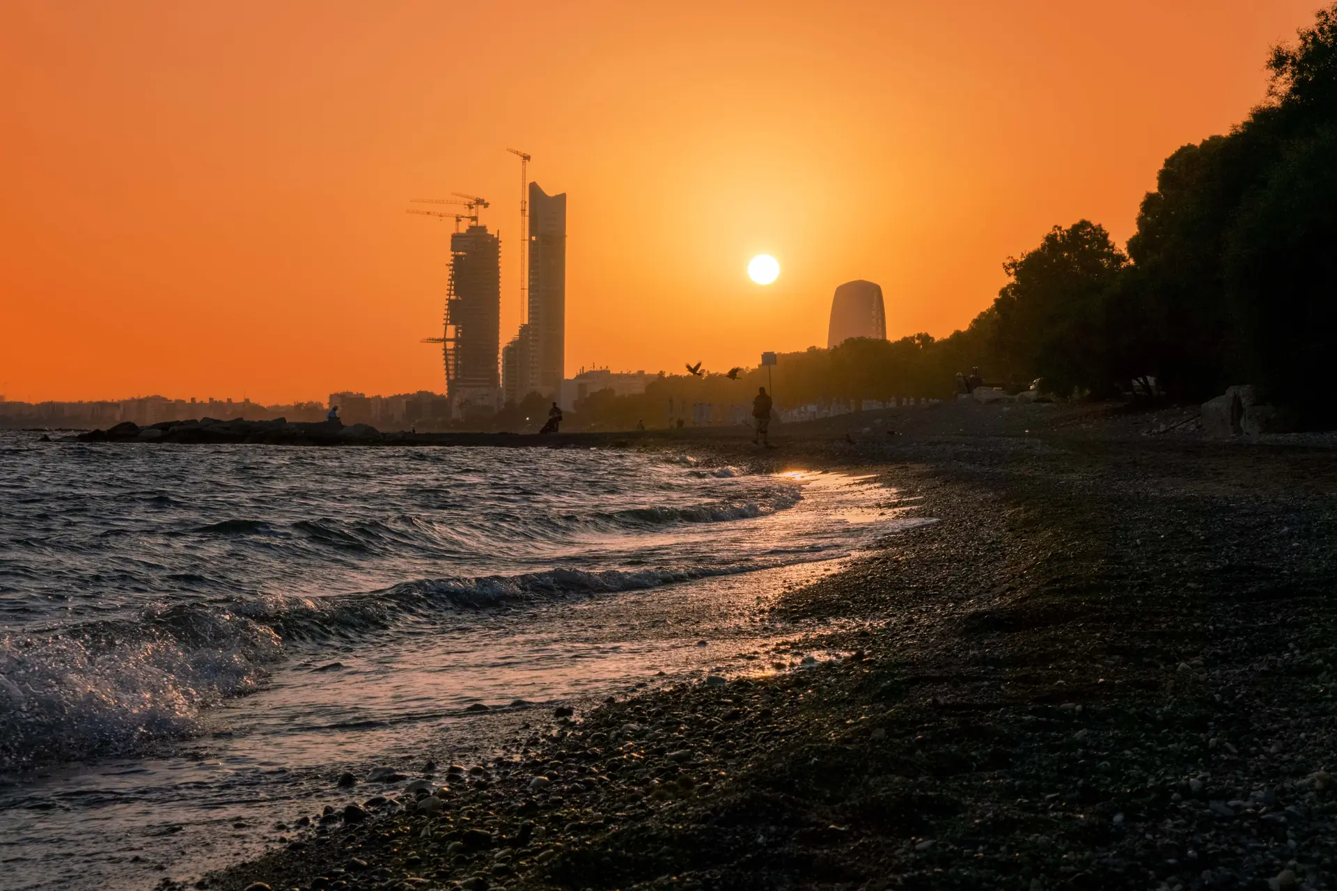 The sun setting over the Limassol coast and skyline